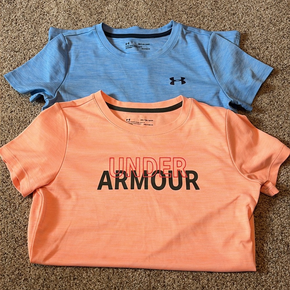 Two women’s Under Armour gym shirts